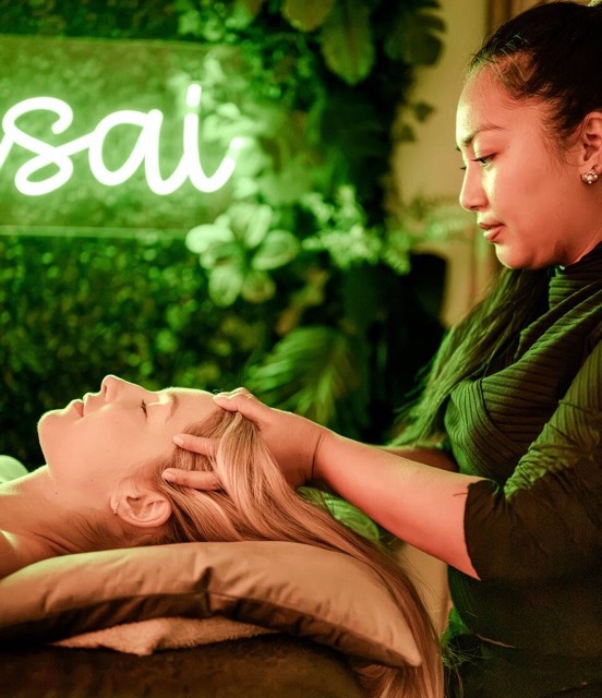 A therapist giving a Thai massage at Bonsai
